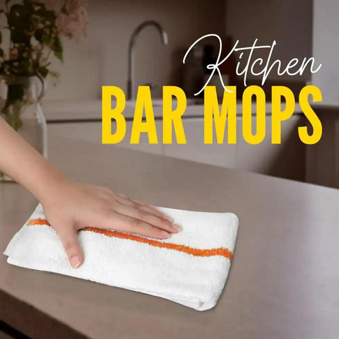 Hand wiping a kitchen counter with 60 Pack 16 By 19 Inch Terry Bar Mop Rags For Cleaning Absorbent And Durable Cotton Cloths