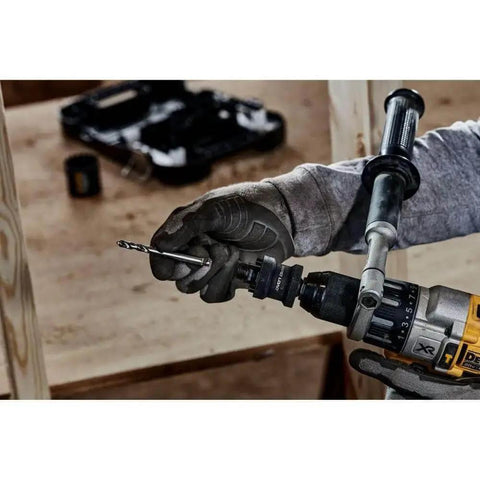 Person using DeWalt Rapid Load Hole Saw Arbor For Drill Half Inch Quick Change System for efficient drilling on wood surface.
