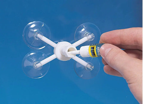 Close-up of Windshield Repair Kit From Rain X for Chips Cracks Bulls Eyes Stars And Laminated Glass With Advanced Resin Formula in use.