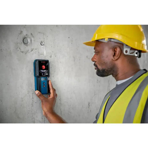 Electrician using Pro Grade Wall Scanner For Electricians And Contractors All In One Multi Function Stud Finder on concrete wall