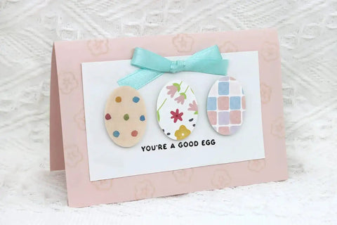 Handcrafted Easter card featuring three oval paper cutouts made with 2 Inch Oval Easter Egg Punch Lever Action Craft Punch.