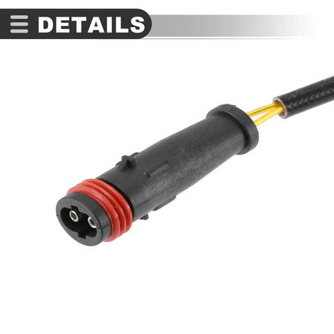 Brake pad wear sensor connector, close-up, black plastic housing with red seal and yellow wires