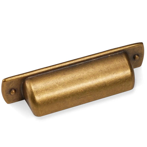 Close-up of a brass cup pull from the 10 Pack 2.5 Inch Antique Brass Cabinet Handles And Cup Pulls Set For Kitchen Cabinets Vintage Drawer Pulls.