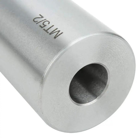 Taper reducing drill sleeve MT5 to MT2, end view; silver machined metal with central bore