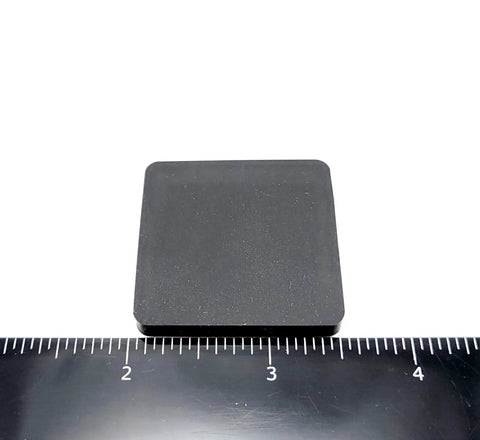 One And A Half Inch Square Silicone Rubber Stick On Feet Bumpers Three Sixteenths Inch Thick Adhesive Pads shown with ruler