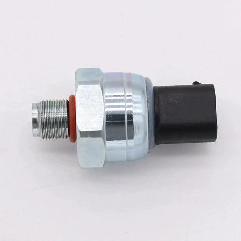 Brake fluid pressure sensor, side view: metal threaded body with hex nut, red gasket, and black connector.