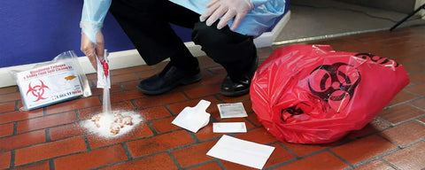 Person using 22 Piece Bodily Fluid Clean Up Kit For Bloodborne Pathogen Spills OSHA Compliant PPE Spill Cleanup Gear on floor tiles