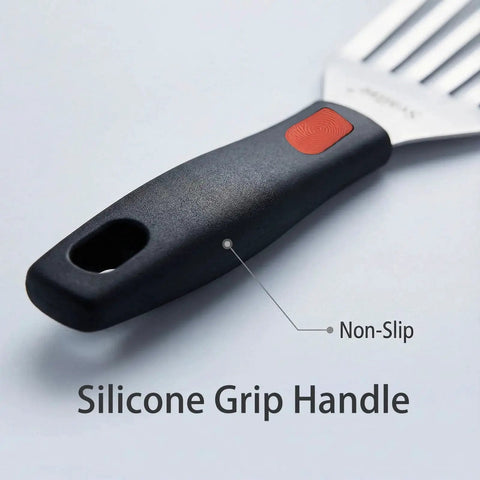 Close-up of a silicone grip handle on a flexible stainless steel fish spatula with slotted turner for kitchen grilling and frying.