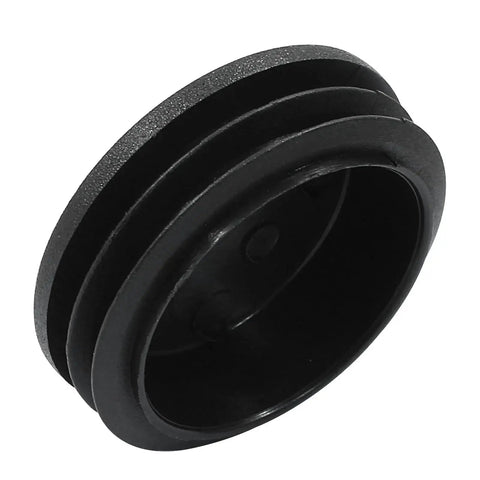Close-up of a 4 Pack 2 Inch Round Plastic Hole Plug Black End Cap for Round Pipe Tubes showing black plastic material and ribbed sides.