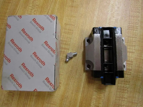 R165129310 Ball Carriage Rexroth Kugelwagen, box, and fastener on wooden surface