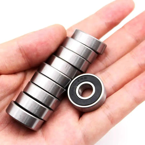 Hand holding 6082RS Ball Bearings For Skateboards Inline Skates Scooters And Roller Blades Double Rubber Sealed Shielded Deep Groove Bearings