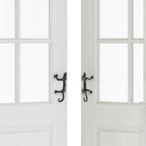 Gecko Shaped Door Pull Handles Set Of 2 In Rustic Dark Coffee Cast Iron on white interior doors, side view showing desert theme design.