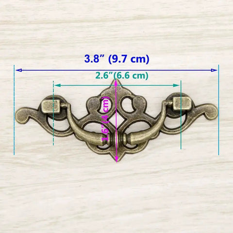 Vintage Antique Brass Bail Pull Handles Set For Wooden Drawers Cabinets And Cupboards Four Pack With Distressed Zinc Alloy Finish And Anti Rust Durability detailing 3.8 inch length, 1.6 inch height, 2.6 inch spacing with measurements displayed.
