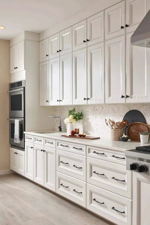 Riverside Pull Grace Collection Honey Bronze 8 13/16 Inch Contemporary Transitional Bar Handle in a modern kitchen setting