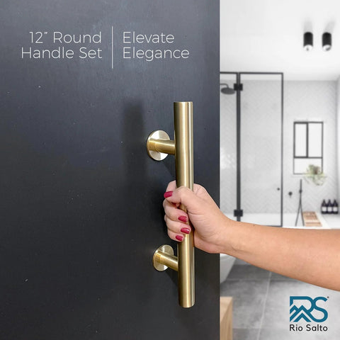 Dope 12 Inch Brushed Brass Gold Barn Door Handle Kit With Solid Aluminum Pulls And Flush Handles Heavy Duty Sliding Door Hardware 1 Door Pack Includes Screws And Protective Pads shown installed on a black interior door with a hand pulling it.