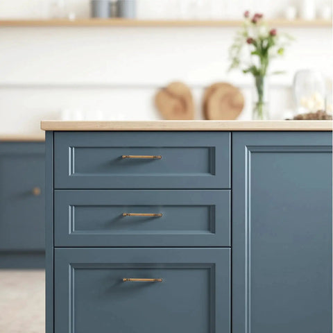Arch Cabinet Handles in Champagne Bronze on blue kitchen cabinets, 5 inch center to center, European style drawer pulls, zinc alloy hardware.