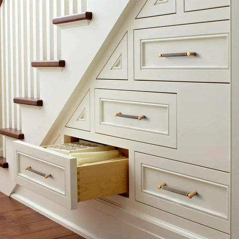 Under-stair drawers featuring Six Pack 5 Inch Center To Center Antique Brass Cabinet Pulls With Knurled Grip And Circular End Caps