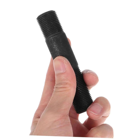 Hand holding a metal component from Hydraulic Punch Driver Kit For Electrical Conduit And Metal Sheets 8-Piece Hole Punch Set