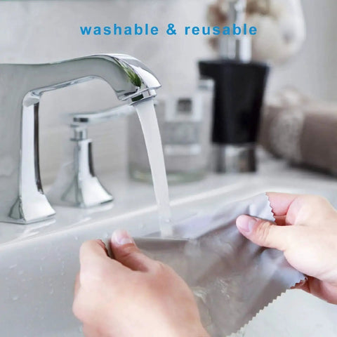 Person washing ultra-soft microfiber cloth under running water, featuring washable and reusable design for glasses and screens.