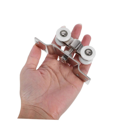 Hand holding Stainless Steel Sliding Door Track Wheels With Nylon Rollers Silent Pulley System for quiet operation