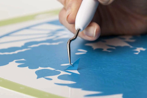 Close-up of Cricut weeder tool from the Go-To 5-Piece Craft Tool Set for Precision Lifts Snips Burnish and Weed by Cricut.