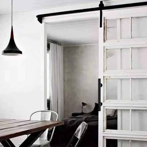 Sliding Barn Door Pull Handle Set With Flush Hardware In Rustic Black Powder Coat Finish on installed white sliding door