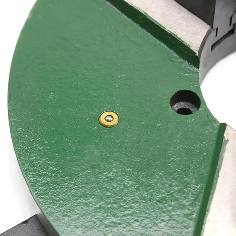 Close-up of 12 Inch Three Jaw Self Centering Welding Positioner Table Chuck With Reversible Jaws And Handle Drive, green steel surface.