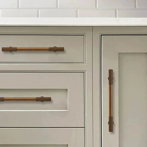 Antique Brass Heavy Duty Cabinet Pulls Ten Pack With 3 Inch Hole Center showing on kitchen drawers and doors, vintage hardware.