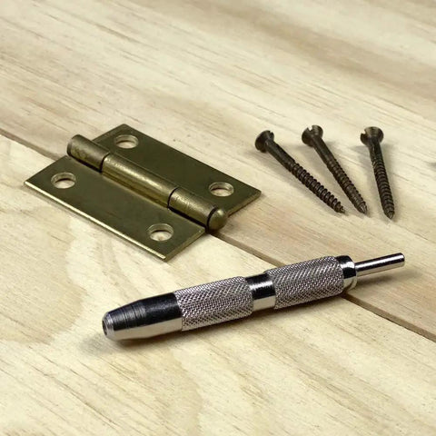 Jiffy Centering Punch For Quick Screw Hole Start In Hinges And Brackets With An Automatic Centering Tip That Slips Right Into Countersunk Holes, Durable Silver Tool From General Tools 806 shown with a hinge and screws.