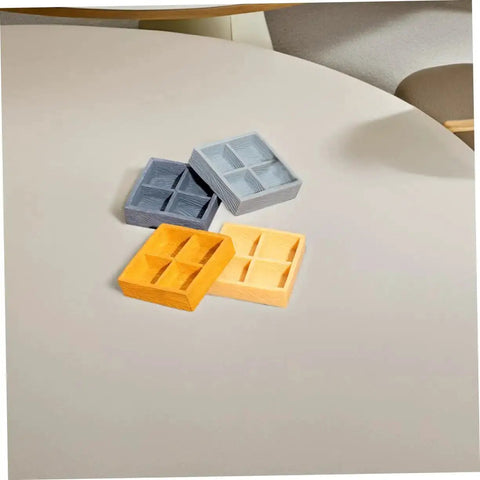 Awesome Four Grid Miniature Dollhouse Storage Box Set for Candy, Nuts, and Tiny Accessories, shown on a table, available in various colors.