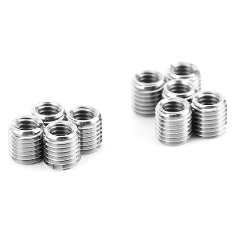 Front view of ten silver metal threaded inserts with ridged exterior and internal threads
