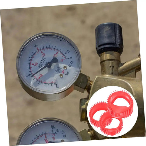 Five red silicone gauge protector sleeves for gas regulator gauges (acetylene/oxygen); front view.