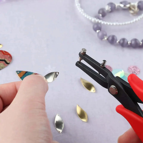 Using 1.5mm Hole Punch Pliers with Replacement Pins for Soft Metals on silver sheet for jewelry making