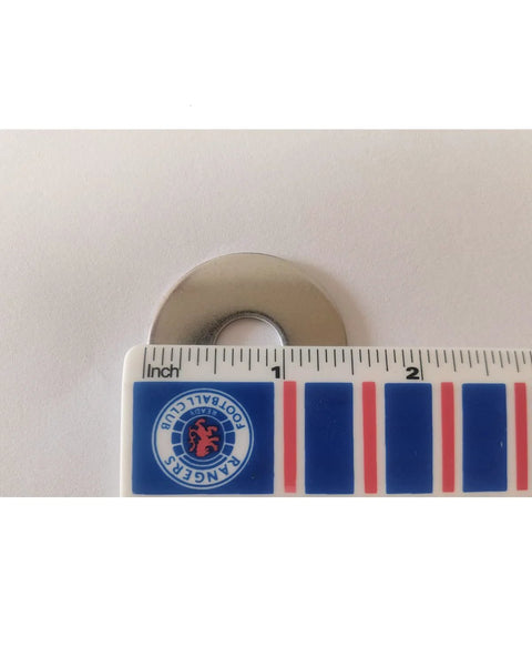 Stainless steel fender washer, 1/2 in ID x 1-1/2 in OD, 304 stainless, shown with an inch ruler