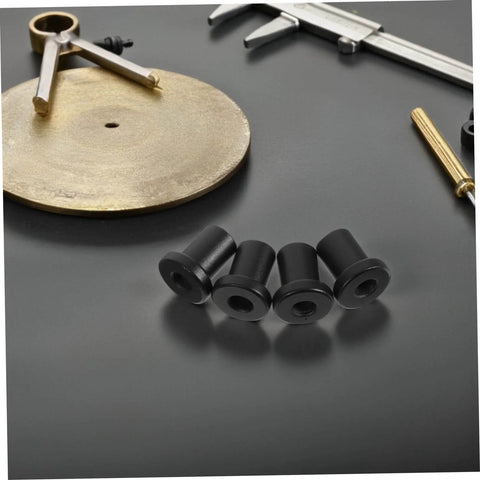 Four black barn door spacers on gray surface, part of Heavy Duty Carbon Steel Barn Door Clamps And Sliding Door Replacement Spacers Set.