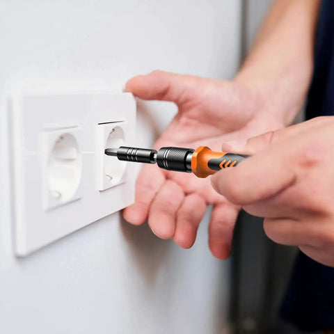 Using 117 In 1 Precision Screwdriver Set with Torx Triwing Bits to repair a wall socket, showcasing multi-purpose tool kit.