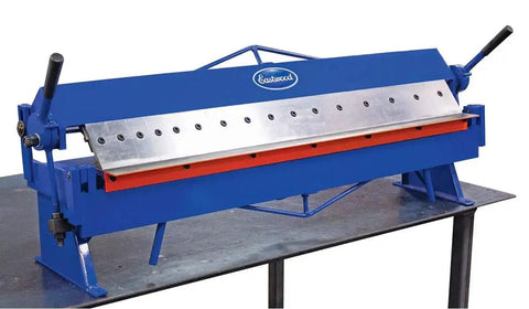 48 Inch Pan And Box Sheet Metal Brake With Adjustable Removable Fingers for precise 135 degree bends and versatility on workshop table.