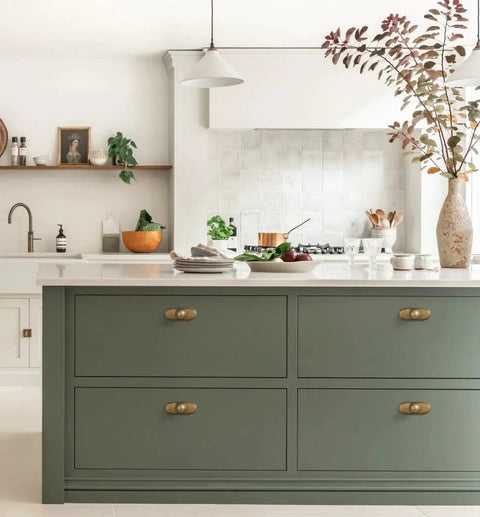 Kitchen with Antique Brass Cabinet Knob With Backplate Set on green drawers, 24mm zinc alloy, vintage brushed finish, six pack installation.