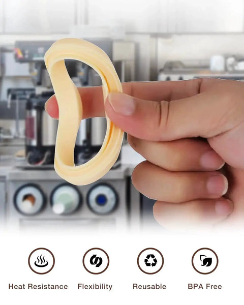 Close-up of two beige 54mm silicone steam rings for Breville/Sage espresso machines, gasket replacement.