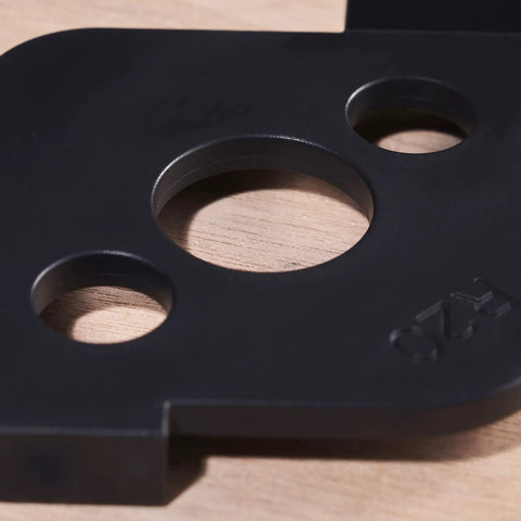 Close-up of Radius Jig Router Templates 4 Pack With 8 Radius Sizes For Woodworking in black ABS, showing circular openings.