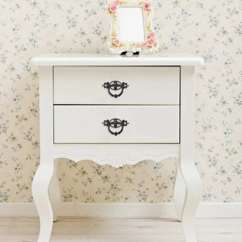 White dresser with Antique Ring Handle Drop Pulls 2.56 Inch Cabinet Hardware, vintage zinc alloy, floral wallpaper in background.