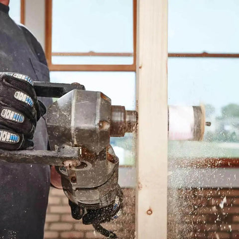 Bi Metal Speed Slot Hole Saw Two And Three Quarter Inch for metal and wood, cutting through a wooden plank with drill machine.