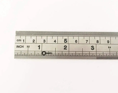 Black Tiny Screw Eye Pin next to a ruler for scale, measuring 10x4 mm, used in jewelry making and craft projects, durable and rust resistant.