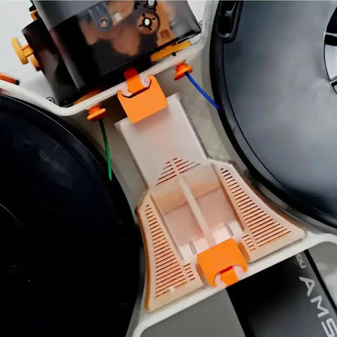 Close-up of Spool Housing Kit for Lite Mini Filament Dryer A1 and A1 Mini, showing detailed orange components and housing structure.