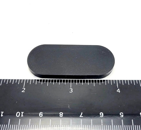 2 Inch By 3/4 Inch Oval Silicone Bumper Feet 3/16 Inch Thick With Strong Adhesive Backing next to ruler for size reference