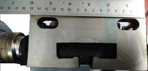 Close-up of 6 inch rotary milling table with ruler, showcasing 150 mm MT2 diameter and 4 slot design for horizontal and vertical milling.