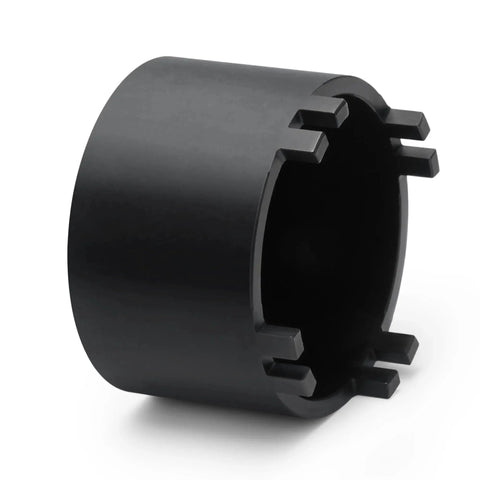 Close-up of a metal front differential sundial bearing carrier retainer seal installer removal socket tool for Subaru transmission service