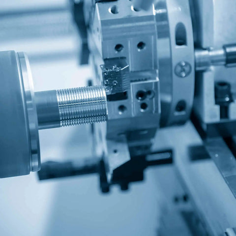 Close-up of Heavy Duty Fully Threaded M4x100mm Stainless Steel Rods Set in machine tool for structural fastening and mounting.