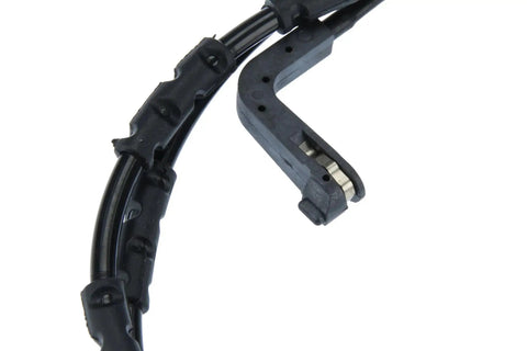 Front brake pad wear sensor, black plastic housing with wiring harness and metal contact clip