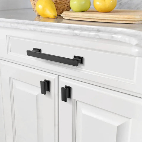Front view of 10 Pack 5 Inch Matte Black Cabinet Handles for kitchen cabinets and drawers, installed on white cabinetry.
